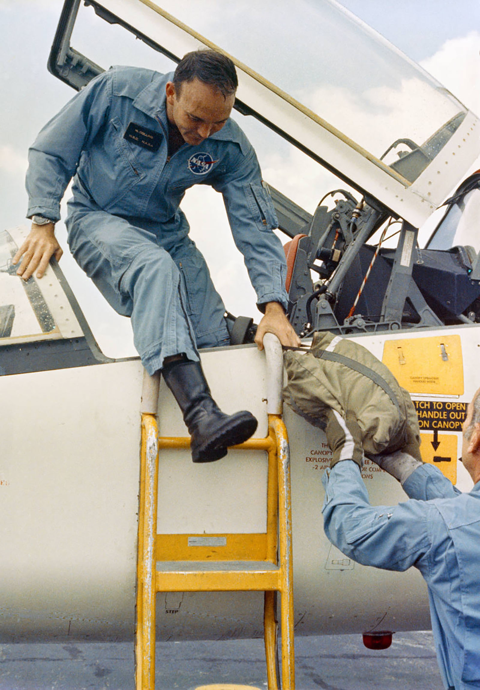 A photo of astronaut, Collins exiting out of T-38 jet