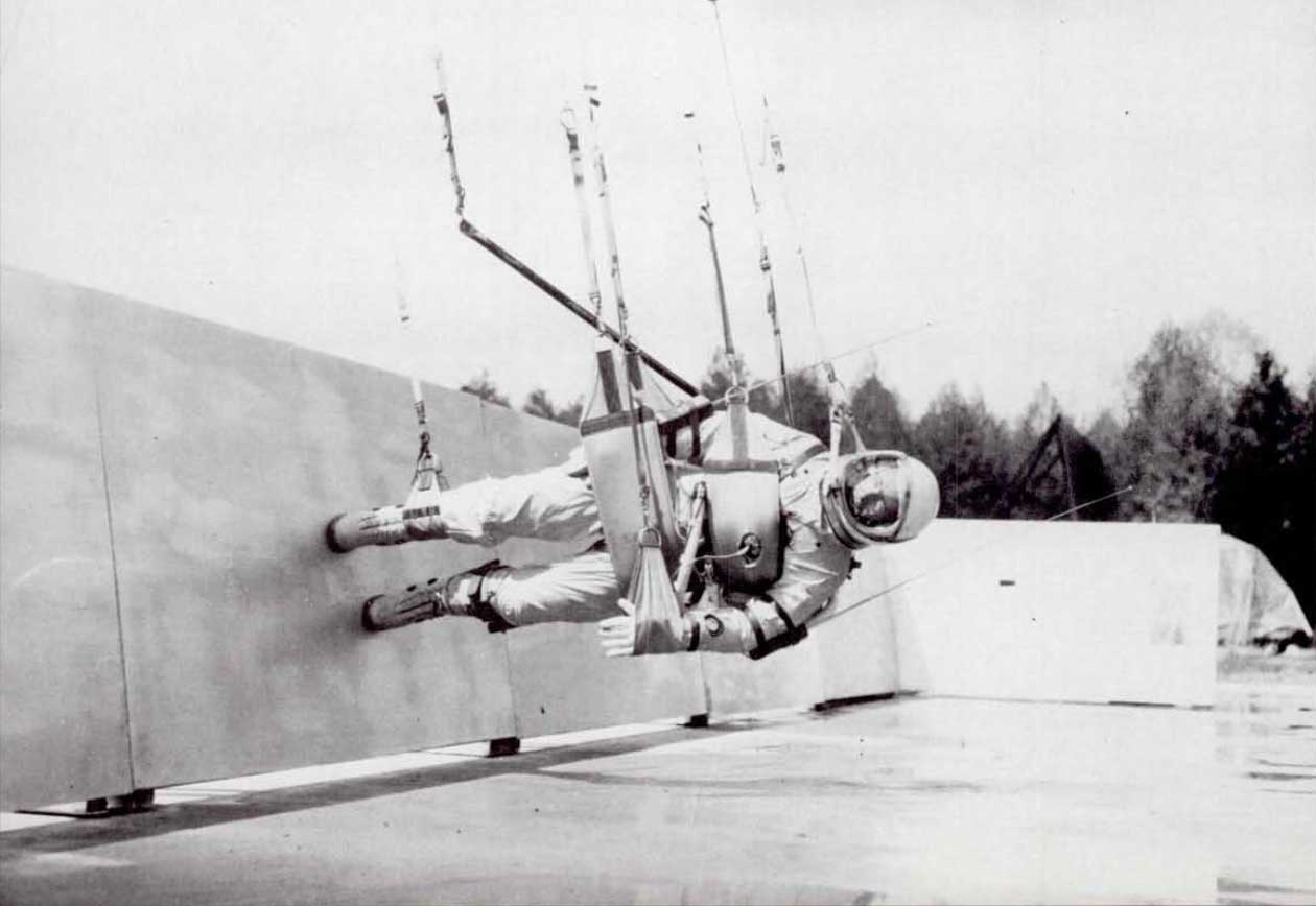 A photo of astronaut suspended in air on his side