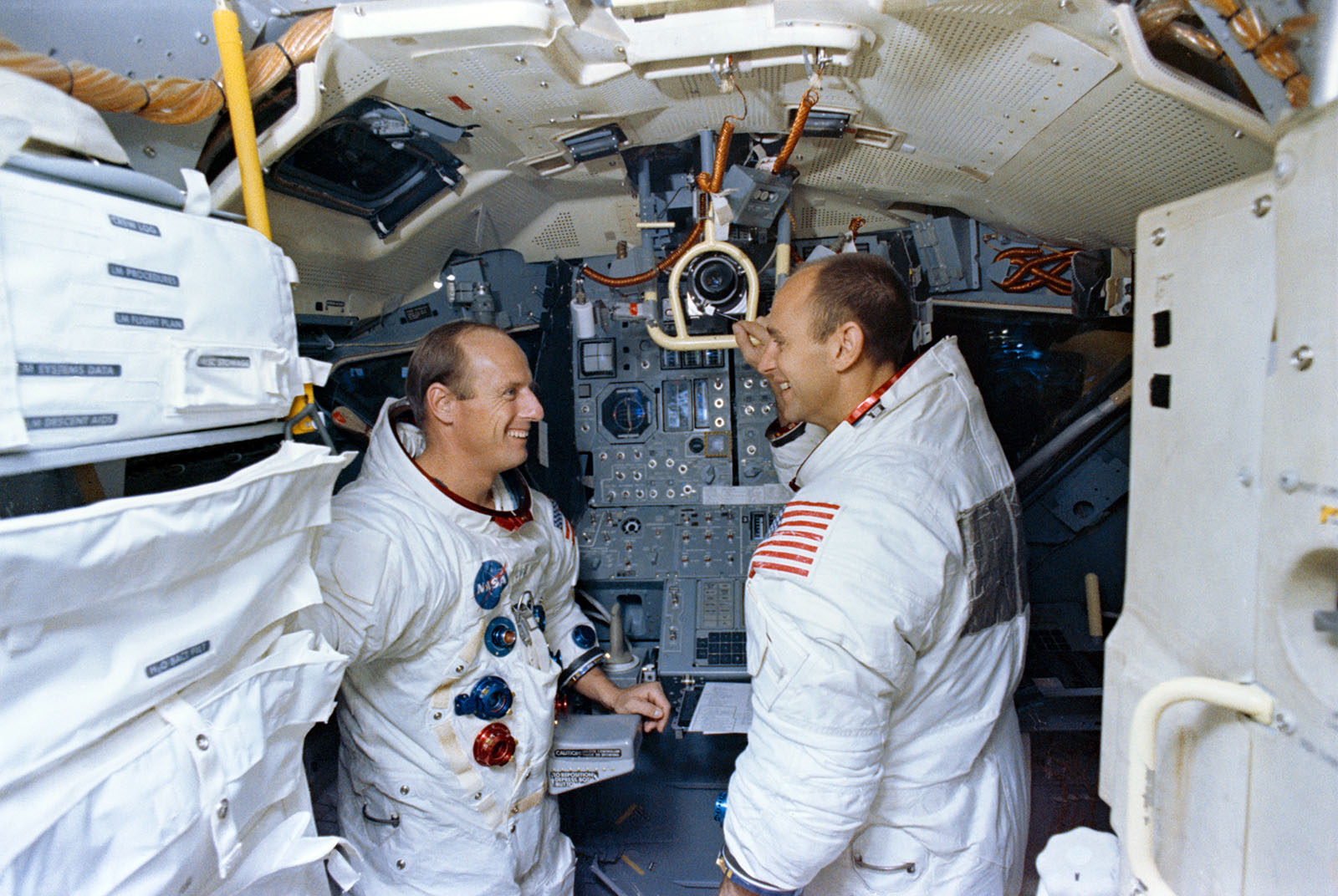 A photo of astronauts,Conrad and Bean in the LM simulator