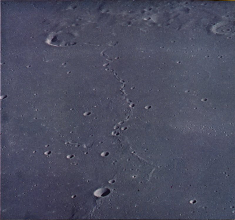 FIGURE 197. - A number of mare related features are present in this oblique view looking north across a mare surface between Mare Imbrium and Oceanus Procellarum.