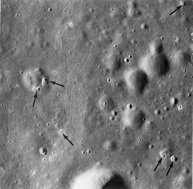 FIGURE 235. - Several extraordinary, tiny, puckered, collapse depressions (arrows) are in this detailed view of a very small area of western Mare Serenitatis.