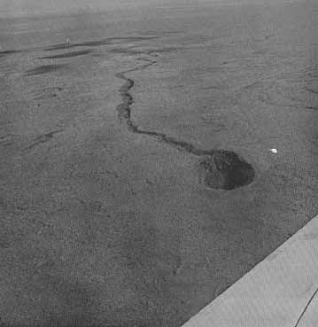 FIGURE 189. - This volcanic crater and lava channel are near Craters of the Moon National Monument in southeastern Idaho.