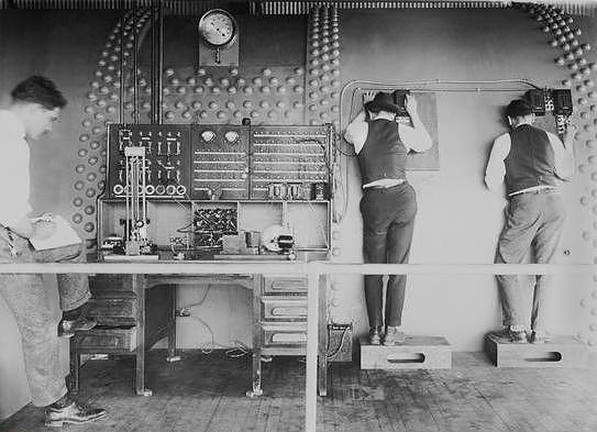 Wind tunnel operators observing experiment