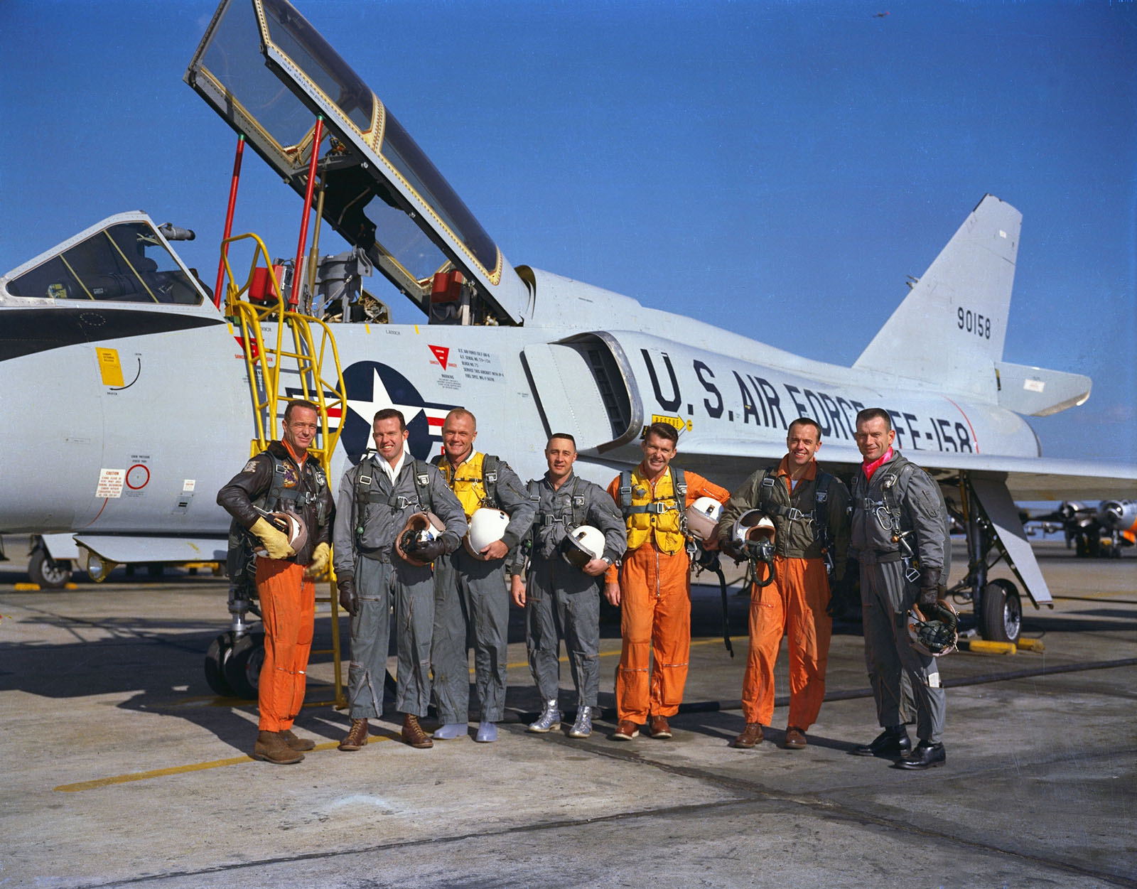 astronauts in flight gear posing in front of F-106